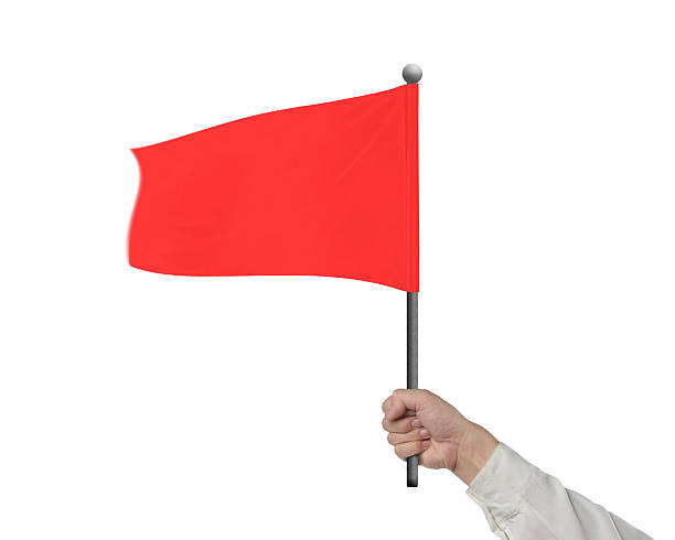 istock Man hand holding wavy red flag isolated in white 511466354