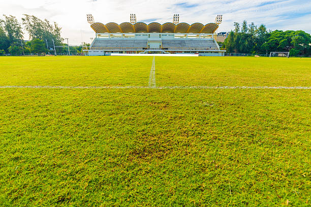 istock Empty football field stadium with lamps 511467252