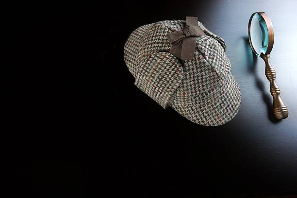 istock Deerstalker Hat,   And Vintage  Magnifying Glass On Black Background 511471956