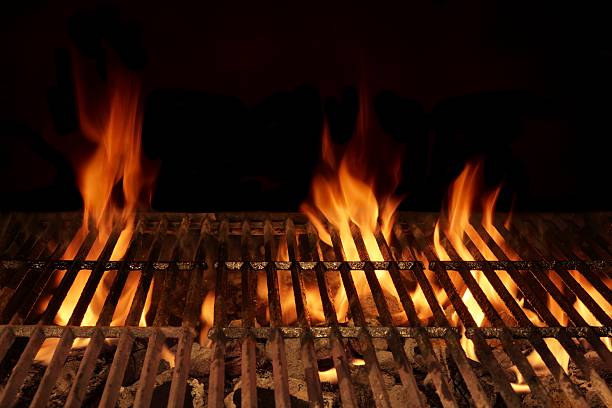 istock Empty Flaming Barbecue Grill Isolated On Black Background. Top V 511472926
