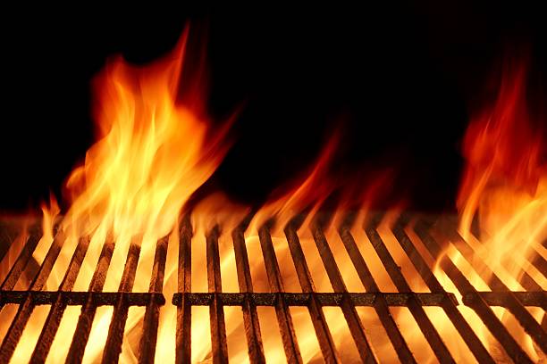 istock Empty Flaming Barbecue Grill Isolated On Black Background. Top V 511472976