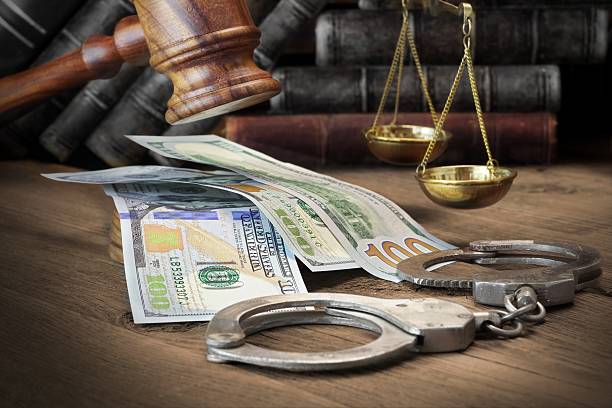 Concept For Corruption, Bankruptcy Court, Bail, Crime, Bribing, Concept For Corruption, Bankruptcy Court, Bail, Crime, Bribing, Fraud, Judges Gavel, Soundboard And Bundle Of Dollar Cash On The Rough Wooden Textured Table Background. bail law stock pictures, royalty-free photos & images