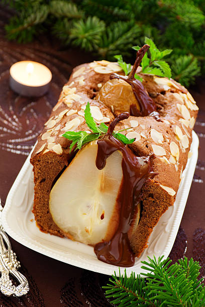 istock Chocolate cake with pears and chocolate sauce. 511475673