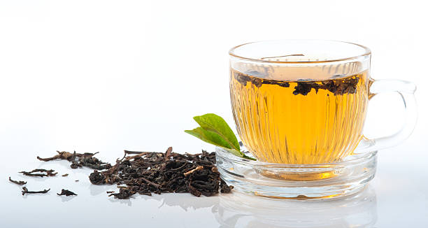 istock Glass Cup Tea with green leaves, Isolated on White Background. 511476235