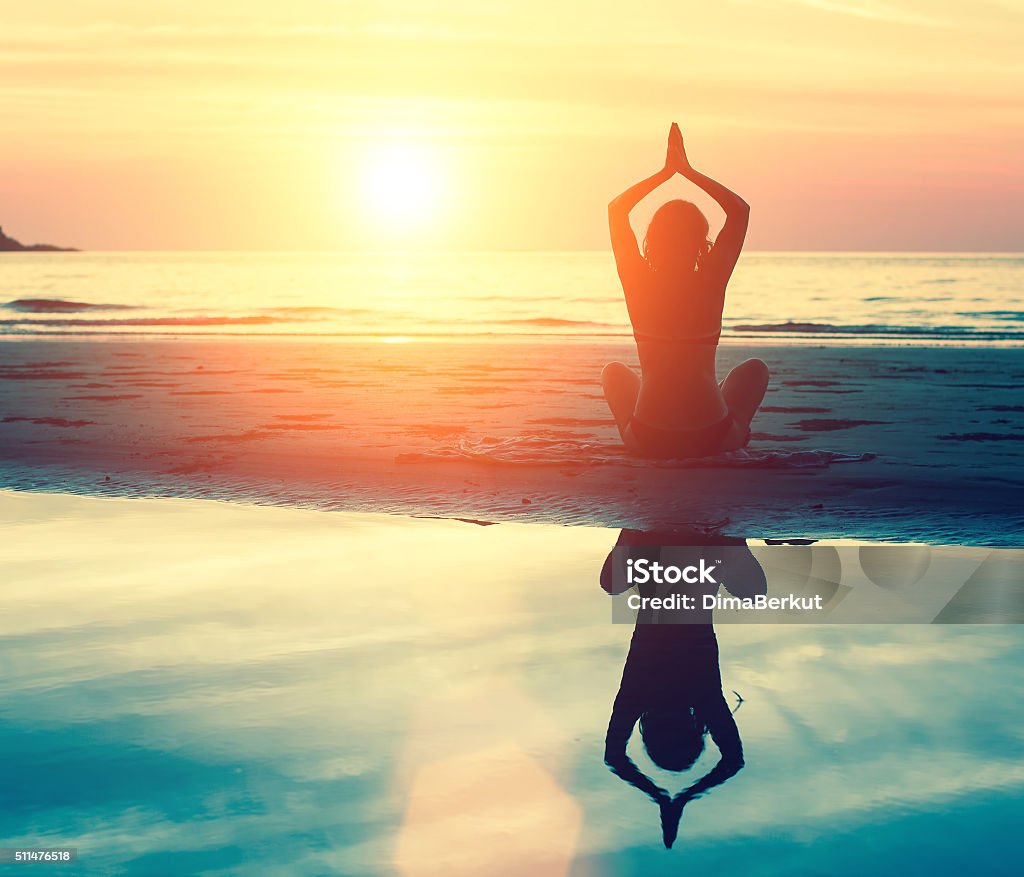 Meditation, serenity and yoga practicing at sunset. Abstract Stock Photo