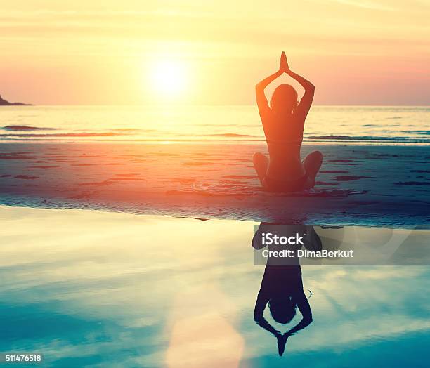 Meditation Serenity And Yoga Practicing At Sunset Stock Photo - Download Image Now