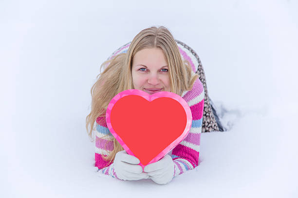 istock Young woman with red heart and smiling. Valentines day. 511476766