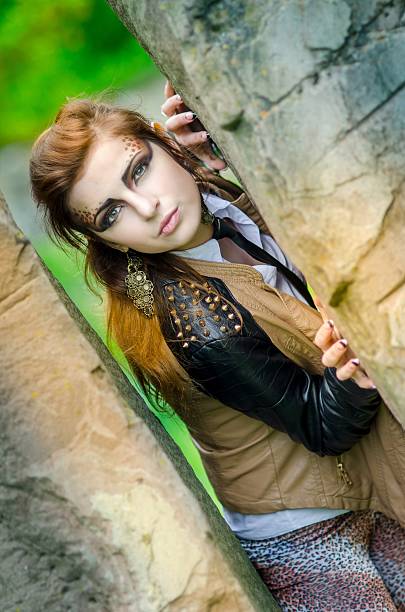 istock Attractive girl with makeup wild leopard on nature 511478023