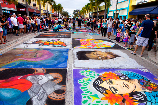 Lake Worth, Florida, USA - February 21, 2016: Annual Lake Worth Florida Street Painting Festival host over 400 Artists that use the pavement as canvas to transform the downtown streets into masterpieces of art during the 2 day event. Over 100,000 visitors will attend this event each year.
