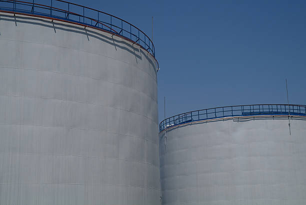 istock Big industrial oil tanks in a refinery base 511478942
