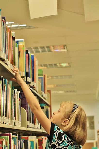 istock Little Girl at the Library 511479443