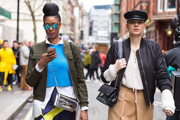 Guests outside David Koma during London Fashion Week AW16 London, United Kingdom - February 21, 2016: Guests outside David Koma fashion show during London Fashion Week Autumn Winter 2016. london fashion week stock pictures, royalty-free photos & images