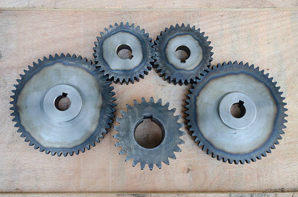 istock Metal gears on wood background. 511480606