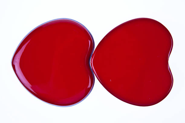 istock Two red hearts together isolated on white background 511480686