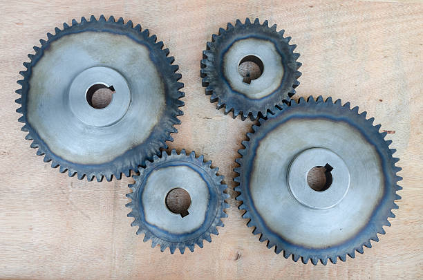 istock Metal gears on wood background. 511480748