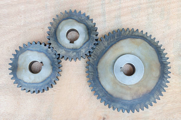istock Metal gears on wood background. 511480892
