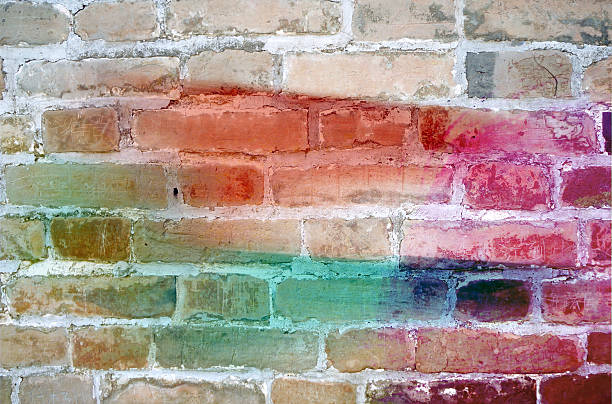istock colors painted on grunge brick wall background 511486120