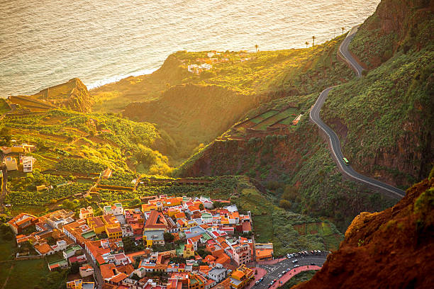 Top view on Agulo coastal village in Spain Top view from Mirador de Abrante on Agulo coastal village on La Gomera island on the sunrise in Spain agulo stock pictures, royalty-free photos & images