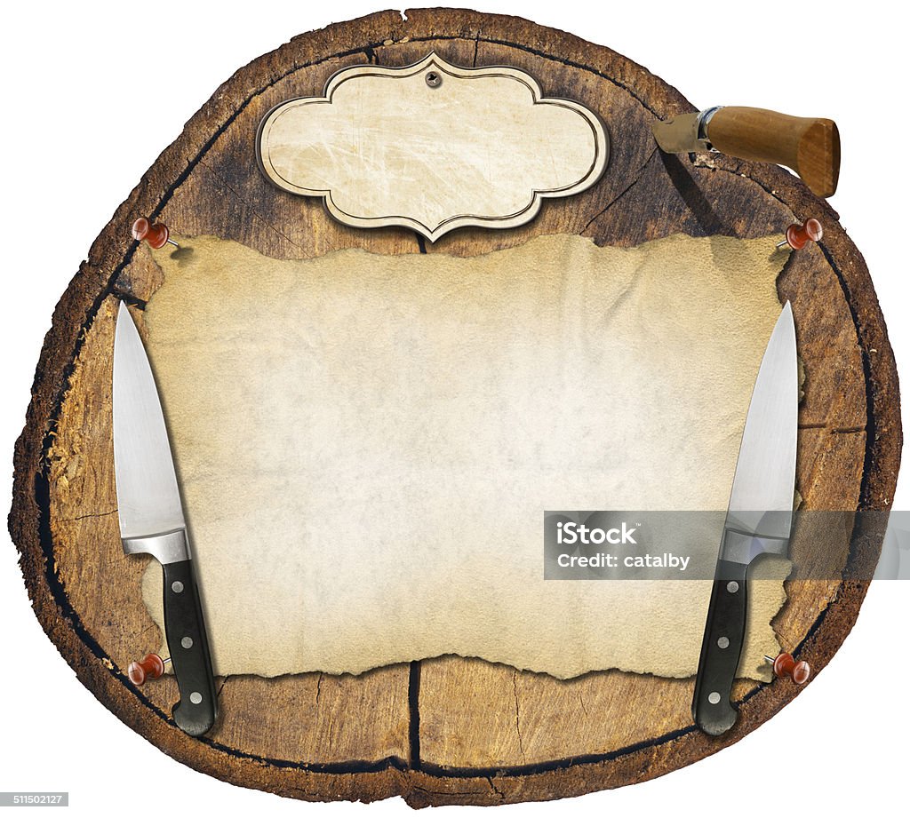 Rustic Menu Background Wooden trunk section background with two kitchen knives, a folding knife, empty parchment and label. Background for a rustic menu. Bar - Drink Establishment Stock Photo