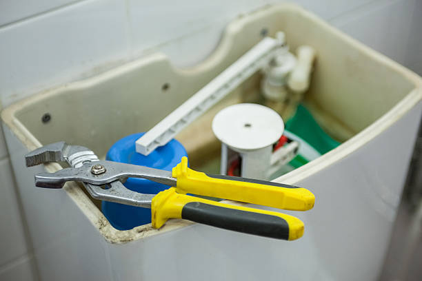 istock Close up of pliers lying on toilet 511503803