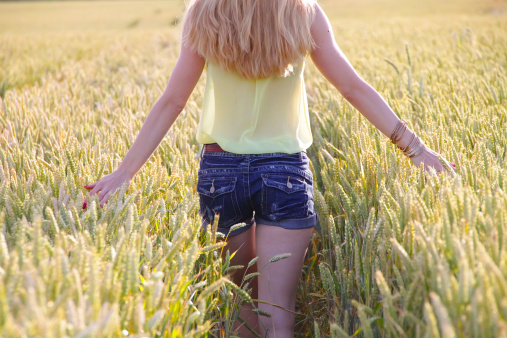 Girl in a corn field a summers in the sun