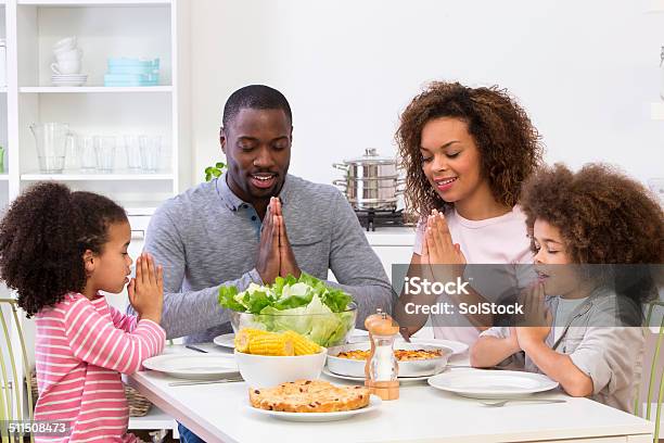 Family Sitting Down To A Meal Stock Photo - Download Image Now - Family, Dinner, Meal