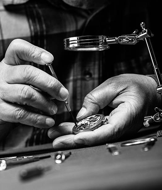 riparare vecchio orologio da tasca - watch maker work tool repairing watch foto e immagini stock