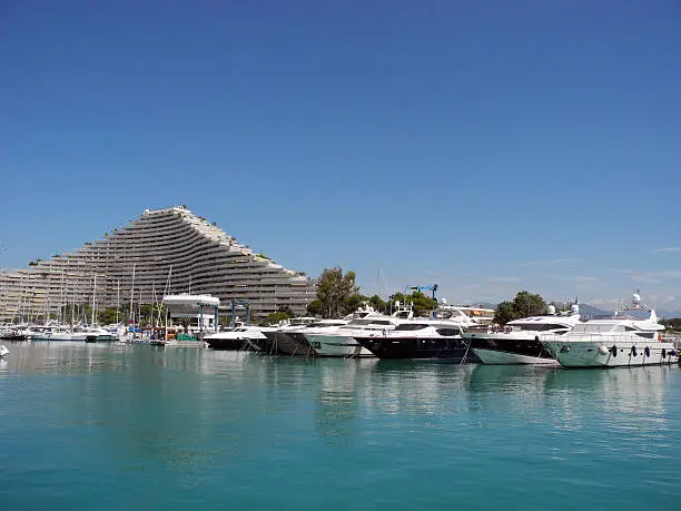 Yachts and House-wave on the Cote d'Azur in France.