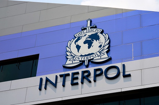 Singapore - September 28, 2014: The International Criminal Police Organization, or INTERPOL, is an intergovernmental organization facilitating international police cooperation. It was established as the International Criminal Police Commission (ICPC) in 1923 and adopted its telegraphic address as its common name in 1956. The organization's headquarters is in Lyon, France. The organization maintains an Interpol Global Complex for Innovation (ICGI) in Singapore to act as its research and development facility. 