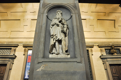 Florence, Italy - November 10, 2010: Statue of Leonardo da Vinci in Uffizi Alley at night in Florence, Italy.