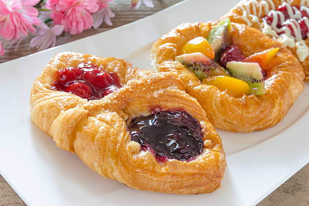 istock danish pastry with fruits on white dish 511517814