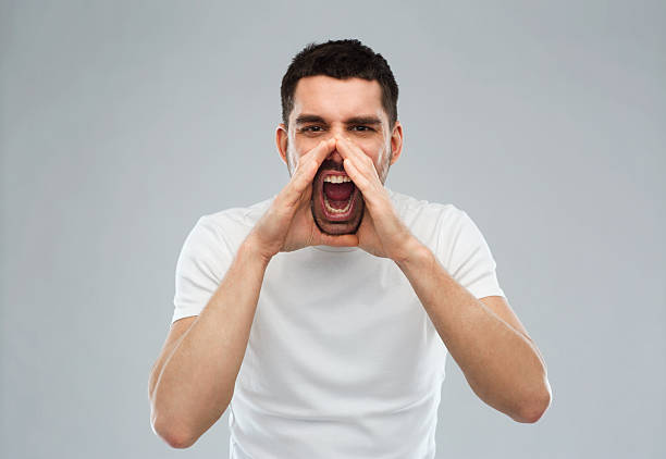 istock angry shouting man in t-shirt over gray background 511524574