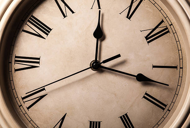 istock dial with Roman numerals and arrows 511524957