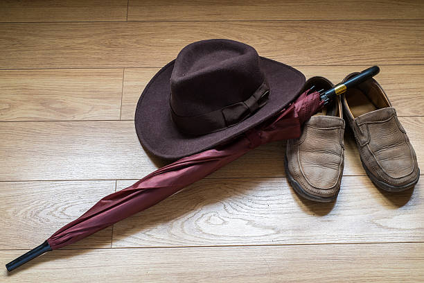 istock Umbrella, shoes and fedora hat 511525059
