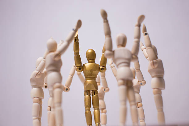 istock Crowd of wooden mannequin 511525067