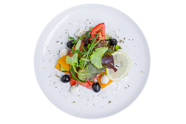istock Fresh Greek salad, top view, isolated 511525662