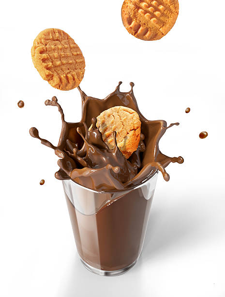 istock Two cookies biscuits falling into chocolate milkshake glass, for 511525803