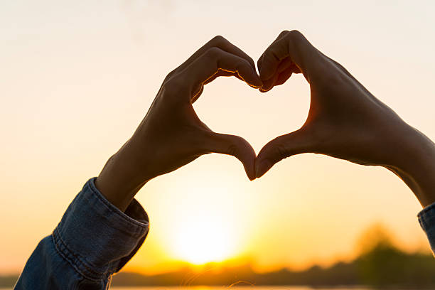 istock Detail of woman's hands making heart shape 511525981