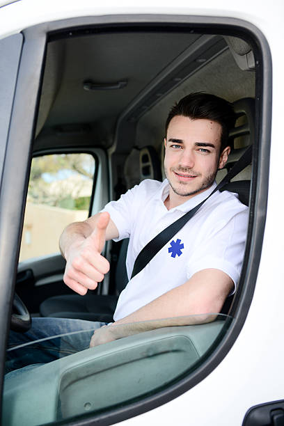 istock young man driving ambulance paramedic transportation 511527260