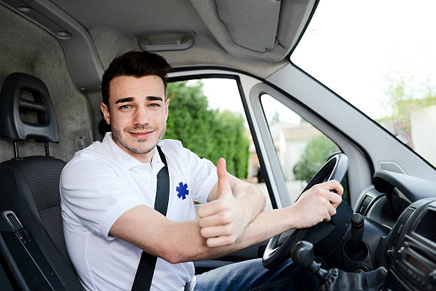 istock young man driving ambulance paramedic transportation 511528022