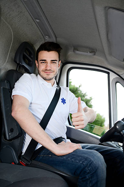 istock young man driving ambulance paramedic transportation 511528274