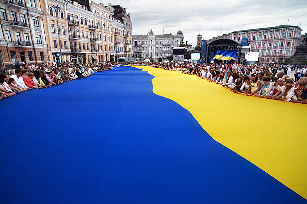 Largest Ukrainian flag Kiev, Ukraine - 24 August, 2014: In the center of Kiev city the largest Ukrainian flag was unfurled. Activists of the public association "Motherland youth" have stretched the cloth on Sophia Square . Flag has arrived from Artemovsk city where it was unfolded on the eve of the Day of the State Flag. Prior to this Ukrainian national flag was traveling around Ukraine - Mariupol, Odessa, Nikolaev, Uman, Cherkasy, Chernivtsi, Lviv and Lutsk. mariupol stock pictures, royalty-free photos & images