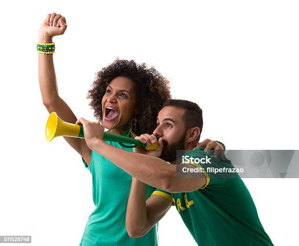 Brazilian Couple Of Fans Celebrating On White Background Stock Photo - Download Image Now