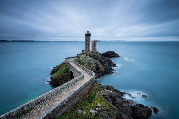 Little Kitty lighthouse The Phare du Petit Minou is a lighthouse in the roadstead of Brest, standing in front of the Fort du Petit Minou, in the commune of Plouzané, France. brest brittany photos stock pictures, royalty-free photos & images