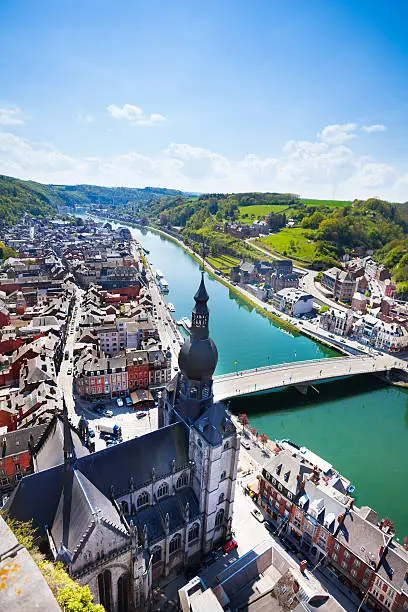 City Dinant with Pont Charles de Gaulle bridge over Meuse river in summer, Belgium
