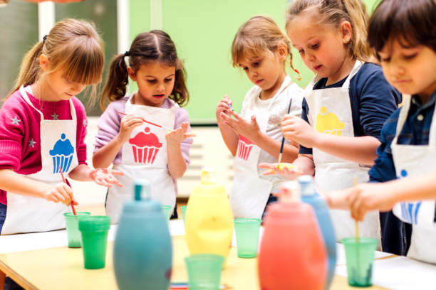 istock Children Painting Their Hands With Watercolors. 511531242
