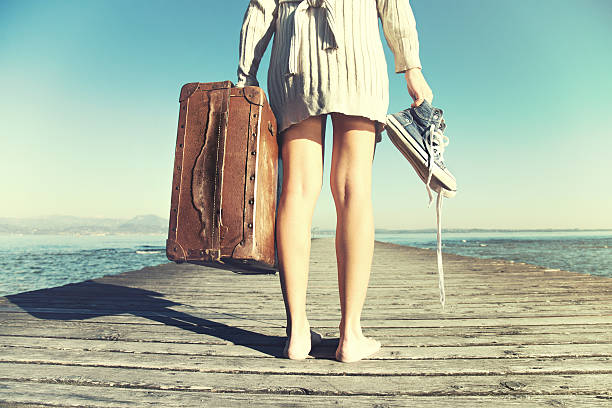 istock traveler woman just arrived to destination with her suitcase 511531848