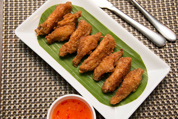 istock Deep fried spicy chicken wing with chili sauce 511531882