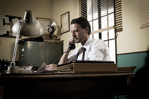 istock 1950s office: director on the phone 511532060