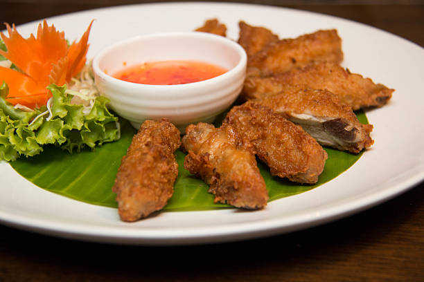 istock Deep fried spicy chicken wing with chili sauce 511532228